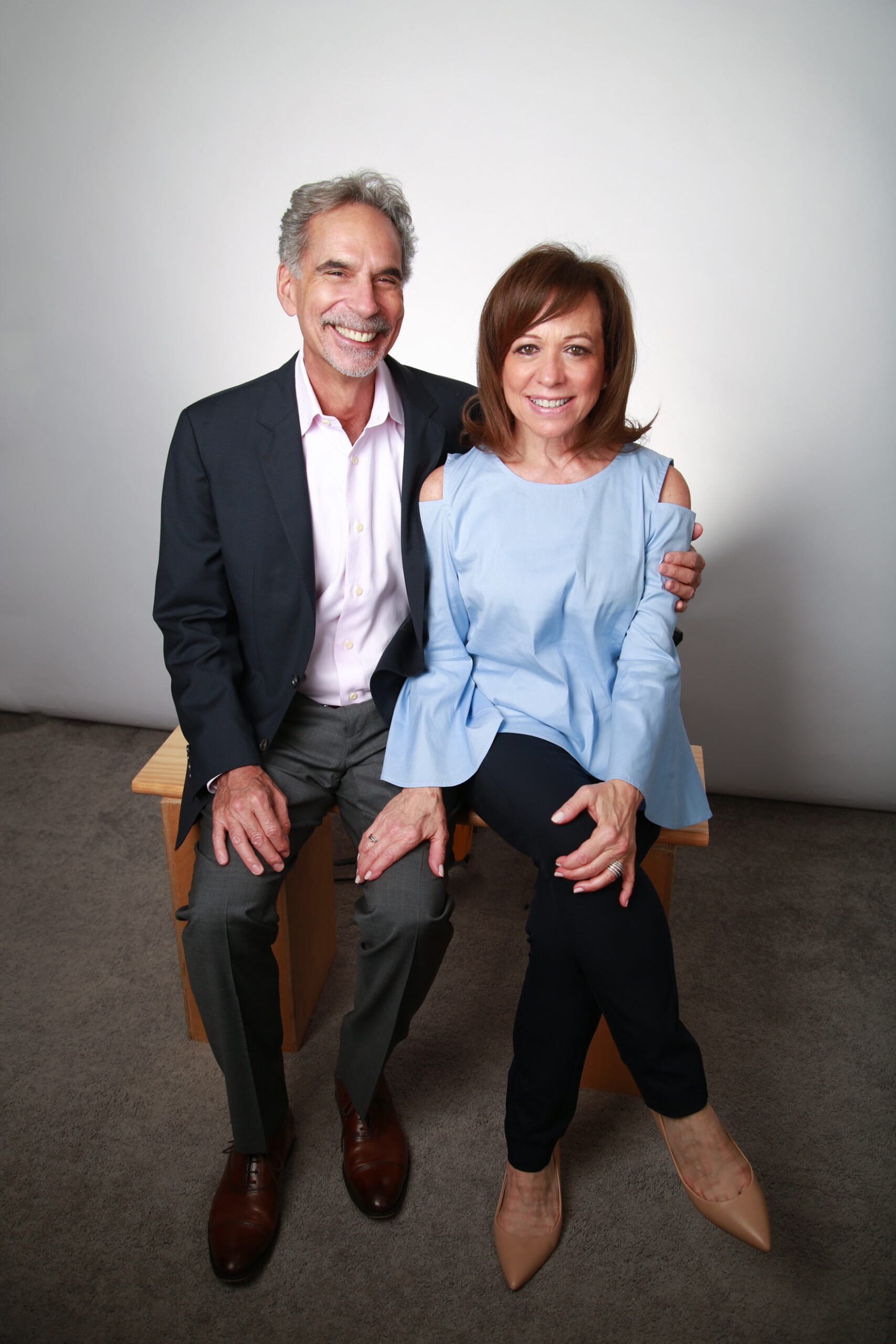 Dr. Kushner and his wife, Nancy Kushner, smiling and seated side-by-side