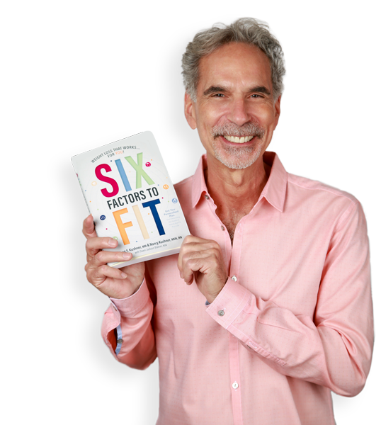 Dr. Kushner holding his book, "Six Factors to Fit"
